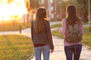 Friends walking together at sunset